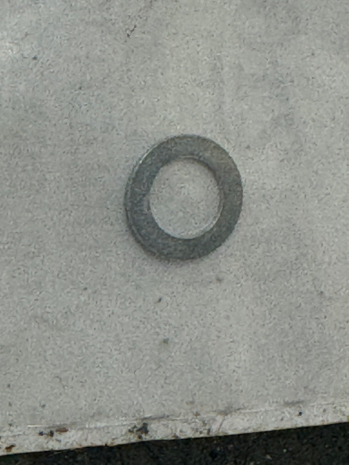 Pump shaft seal retainer