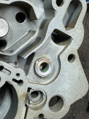 Pump shaft seal retainer