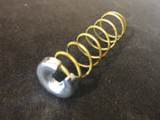Accelerator pump plunger delayer spring